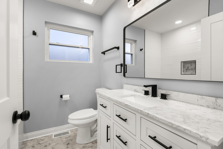 Modern bathroom with marble vanity and mirror