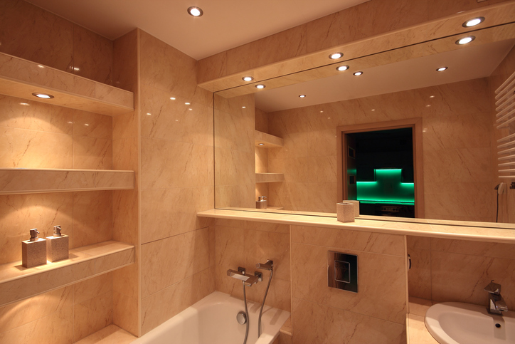 Modern beige marble bathroom with bathtub and mirror